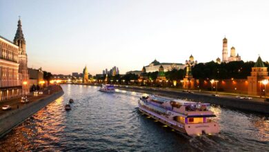 white boat near houses